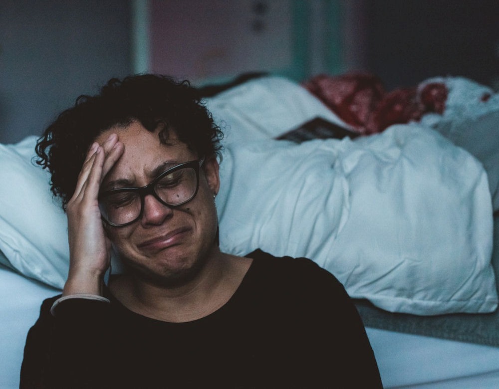 a woman suffering from pmdd